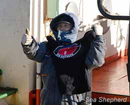 A very happy Sun Laurel crewmember posing<br> with his new Sea Shepherd shirt<br>photo: Sea Shepherd Australia/Glenn Lockitch