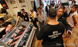 Event personnel try to stop Sea Shepherd from documenting the sampling. Photo: Alex Hofford
