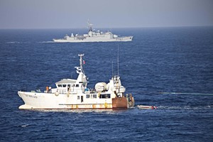 Fishing boat and French frigate